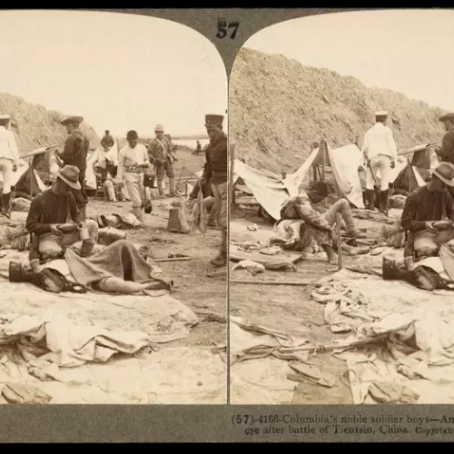 American soldier helping a Japanese soldier during the Boxer Rebellion ,1901, photography by James Ricalton.