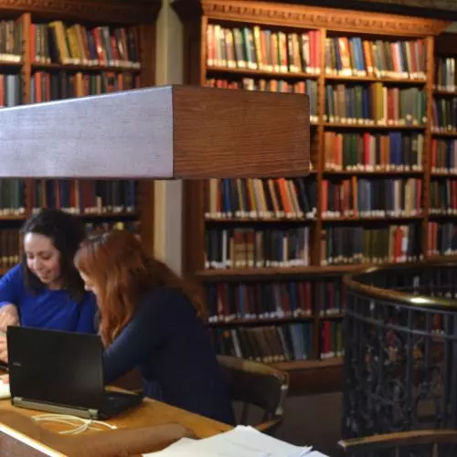 Two students studying in the History Faculty Library